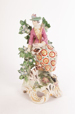 Lot 362 - A Derby figure of a huntress, seated with a...