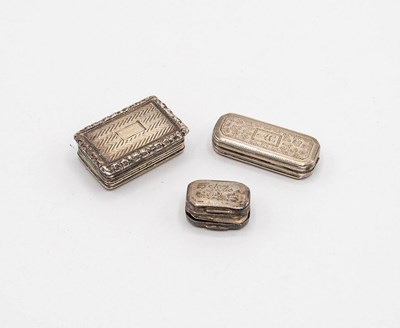 Lot 46 - Three Georgian silver vinaigrettes, the...