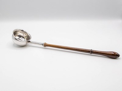 Lot 64 - A Georgian silver toddy ladle, the plain bowl...