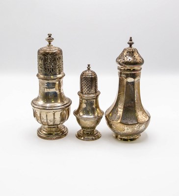 Lot 76 - Three Edwardian silver sugar sifters, makers...