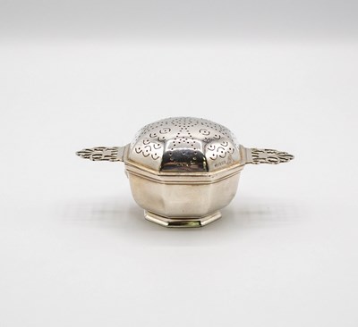 Lot 88 - An octagonal silver tea strainer, Garrard & Co...