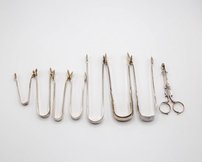 Lot 93 - Seven pairs of silver sugar nips and a pair of...