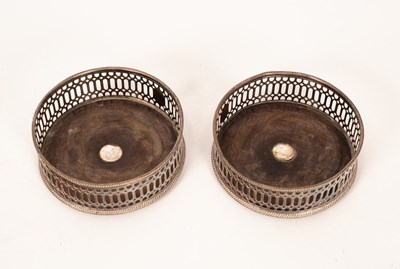 Lot 191 - A pair of silver plated mounted wine coasters,...
