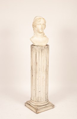 Lot 579 - A Classical plaster bust on a fluted wooden...