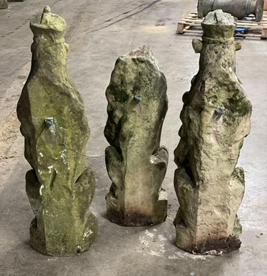 Lot 617 - Three carved stone figures of lions, each...