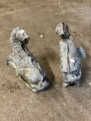 Lot 638 - Two lead dolphins, 27cm wide