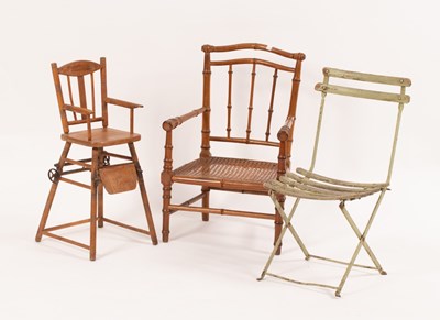 Lot 717 - A child's cane seat spindle back armchair, a...