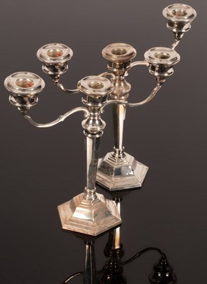 Lot 12 - A pair of modern silver two-branch,...