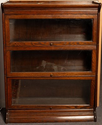 Lot 503 - A Globe Wernicke oak bookcase of three...