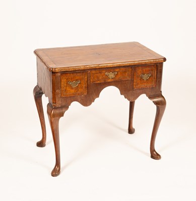 Lot 583 - A George II walnut and featherbanded lowboy,...