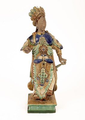 Lot 63 - A Chinese Shiwan pottery figure of a lady,...