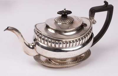 Lot 22 - A George III silver teapot and stand, Robert &...