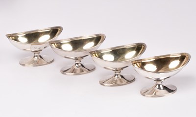 Lot 37 - A set of four George III silver and silver...