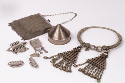 Lot 94 - An Indian white metal tribal hasli, an Indian...