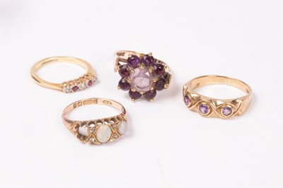 Lot 188 - An 18ct gold ruby and diamond five stone ring,...
