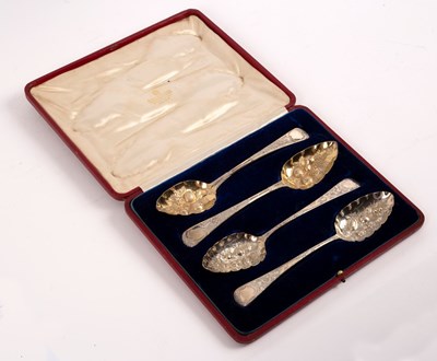 Lot 55 - Two pairs of George III silver berry spoons,...