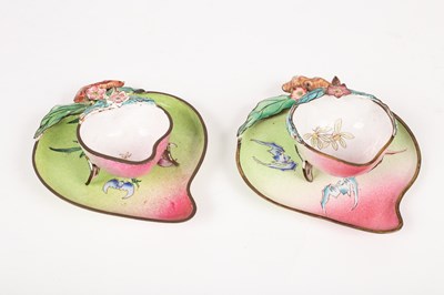 Lot 42 - A near pair of Cantonese enamel cups and saucers