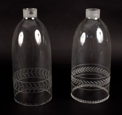 Lot 326 - A pair of glass lantern chimneys with engraved...