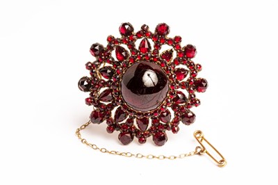 Lot 6 - A Victorian garnet and gilt metal circular...