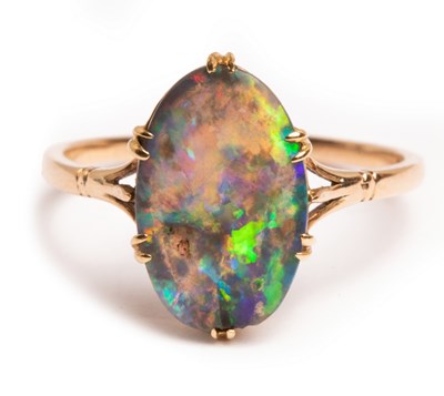 Lot 40 - An Edwardian black opal ring, the oval flat...
