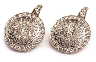 Lot 47 - A pair of Art Deco style circular diamond...