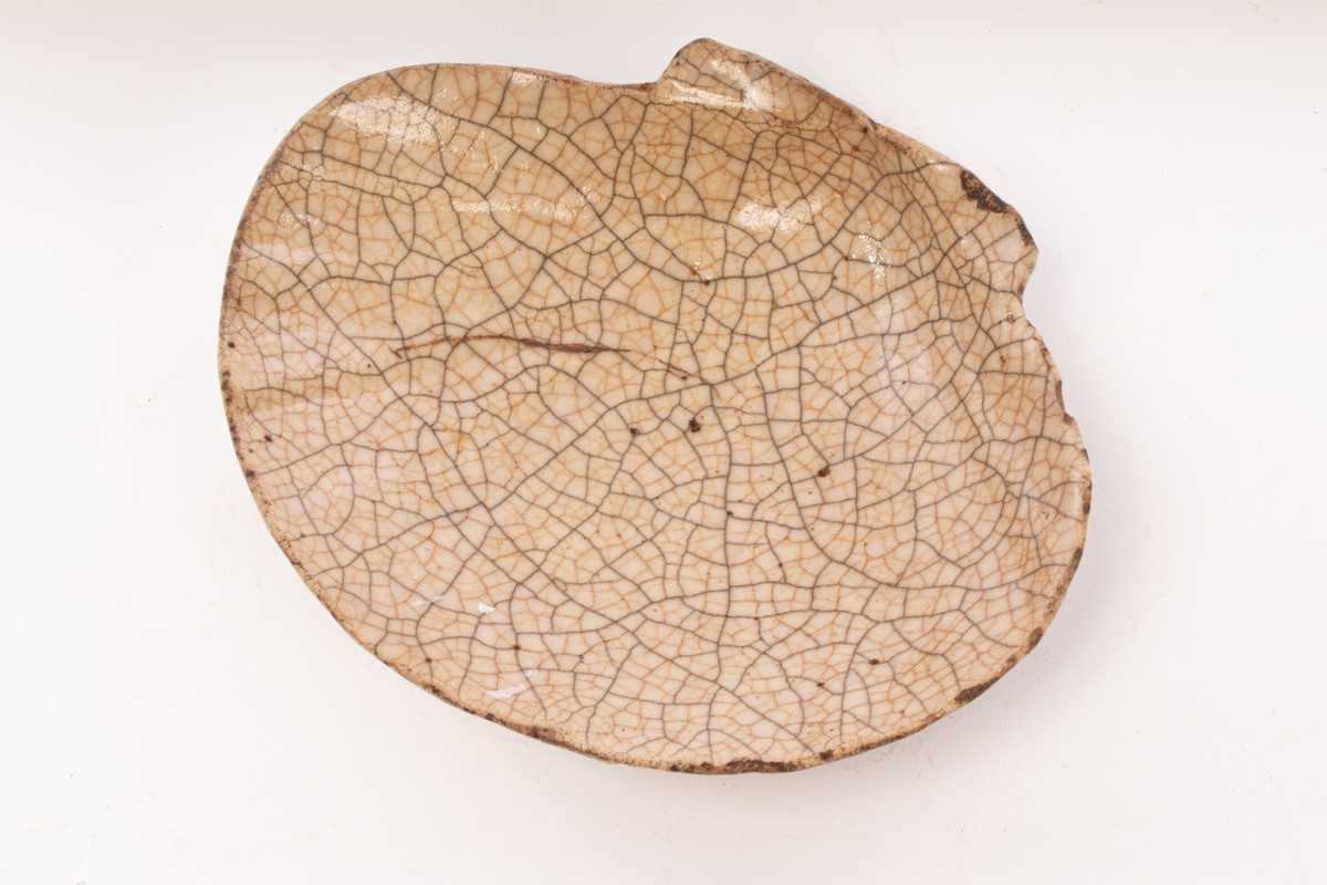 Lot 699 - A Chinese shell-shaped Ge type porcelain dish,...