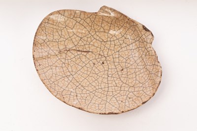Lot 699 - A Chinese shell-shaped Ge type porcelain dish,...