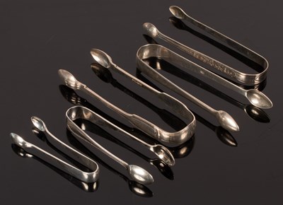 Lot 49 - A pair of George III bright cut silver sugar...