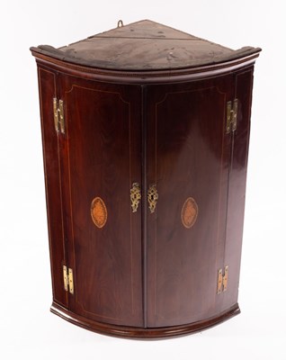 Lot 1148 - A 19th Century mahogany bowfront hanging...