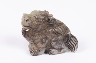 Lot 27 - A Chinese jade carving of a grotesque beast