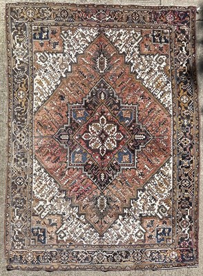 Lot 457 - A small Heriz carpet