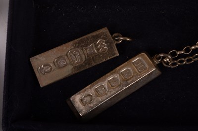 Lot 24 - A pair of novelty silver wishbone sugar nips