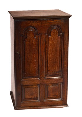 Lot 373 - An early 18th Century oak wall hanging cupboard