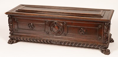 Lot 517 - A 17th Century Italian walnut carved and panelled cassone