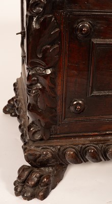 Lot 517 - A 17th Century Italian walnut carved and panelled cassone