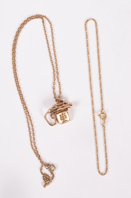 Lot 103 - A 9ct gold telephone charm