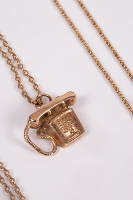 Lot 103 - A 9ct gold telephone charm