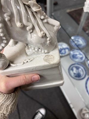 Lot 23 - A Chinese blanc de chine figure of a dog of Fo