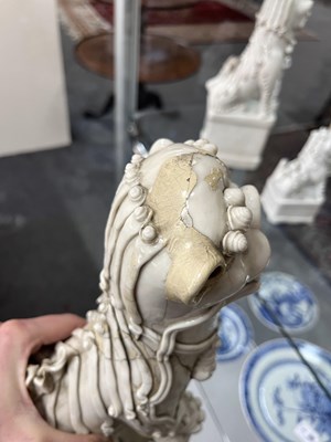 Lot 23 - A Chinese blanc de chine figure of a dog of Fo