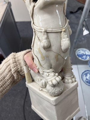 Lot 23 - A Chinese blanc de chine figure of a dog of Fo