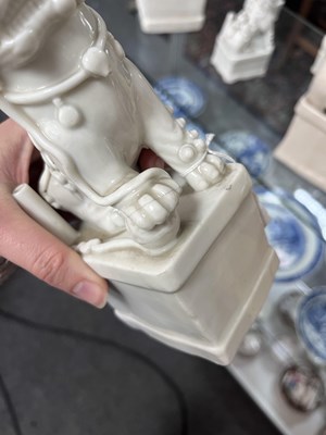 Lot 23 - A Chinese blanc de chine figure of a dog of Fo