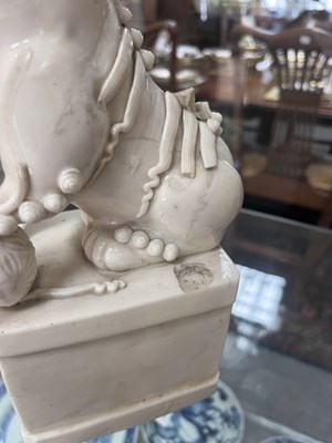 Lot 23 - A Chinese blanc de chine figure of a dog of Fo