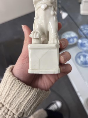 Lot 23 - A Chinese blanc de chine figure of a dog of Fo