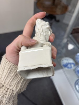 Lot 23 - A Chinese blanc de chine figure of a dog of Fo