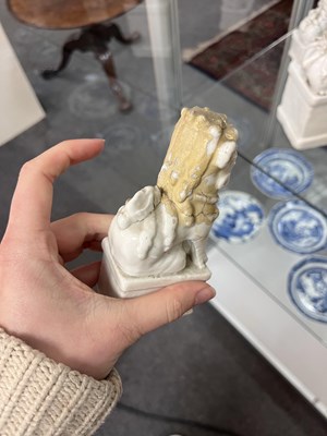 Lot 23 - A Chinese blanc de chine figure of a dog of Fo