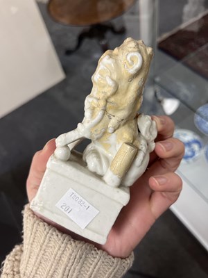 Lot 23 - A Chinese blanc de chine figure of a dog of Fo