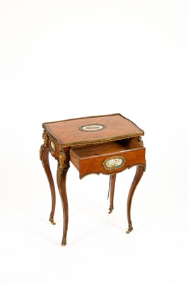 Lot 46 - A French gilt brass mounted kingwood and tulipwood centre table