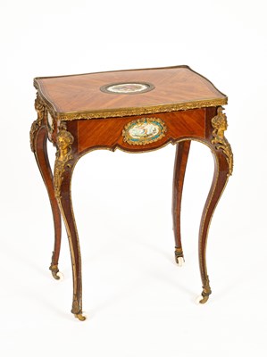 Lot 46 - A French gilt brass mounted kingwood and tulipwood centre table