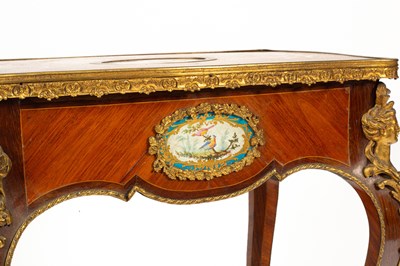 Lot 46 - A French gilt brass mounted kingwood and tulipwood centre table