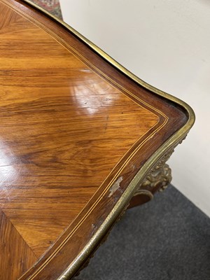 Lot 46 - A French gilt brass mounted kingwood and tulipwood centre table